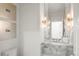 Stylish bathroom features a marble countertop vanity and modern lighting at 96 Glenmoor Ln, Cherry Hills Village, CO 80113