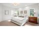 Bright bedroom boasts a plush bed, modern lighting, and refined decor, offering a serene retreat at 96 Glenmoor Ln, Cherry Hills Village, CO 80113