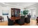 Elegant dining room with hardwood floors, large china cabinet, and neutral decor at 96 Glenmoor Ln, Cherry Hills Village, CO 80113