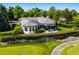 Stunning home with lush landscaping, backing onto a golf course with mature trees at 96 Glenmoor Ln, Cherry Hills Village, CO 80113