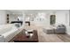 Open basement game room with a lounge area, shuffleboard, and easy access to the stylish wine cellar at 96 Glenmoor Ln, Cherry Hills Village, CO 80113