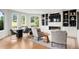 This open living space has a fireplace and large windows overlooking the backyard at 96 Glenmoor Ln, Cherry Hills Village, CO 80113