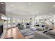 Spacious living room with abundant natural light, a fireplace, and open access to kitchen at 96 Glenmoor Ln, Cherry Hills Village, CO 80113