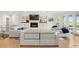 Elegant living area features modern furniture, a cozy fireplace, and stylish built-in shelving at 96 Glenmoor Ln, Cherry Hills Village, CO 80113