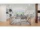 Bright and open floor plan living room with a fireplace, white furniture, and natural light at 96 Glenmoor Ln, Cherry Hills Village, CO 80113