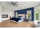 Comfortable main bedroom featuring a fireplace, sitting area, and great natural light at 96 Glenmoor Ln, Cherry Hills Village, CO 80113
