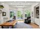 Bright office offers views of the yard from the large picture windows at 96 Glenmoor Ln, Cherry Hills Village, CO 80113