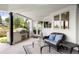 Relaxing covered patio featuring a built-in grill, comfortable seating, and views of the outdoors at 96 Glenmoor Ln, Cherry Hills Village, CO 80113