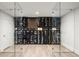 Stunning wine cellar with glass doors showcasing an extensive collection, ideal for the discerning connoisseur at 96 Glenmoor Ln, Cherry Hills Village, CO 80113