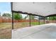 Covered back patio featuring a concrete surface and view of the fenced backyard at 1758 S Tucson St, Aurora, CO 80012