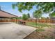 View of the backyard showcasing the concrete patio and a built-in grill at 1758 S Tucson St, Aurora, CO 80012