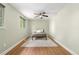 Cozy bedroom with neutral tones, ceiling fan, hardwood floors and natural light at 1758 S Tucson St, Aurora, CO 80012