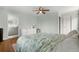 Bedroom with ensuite bathroom, light-filled with walk-in closet and hardwood floors at 1758 S Tucson St, Aurora, CO 80012