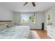 Bedroom features a large window with a view of mature trees at 1758 S Tucson St, Aurora, CO 80012