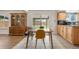 Kitchen dining area featuring wooden cabinets and hutch with sliding door to backyard at 1758 S Tucson St, Aurora, CO 80012