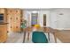 Bright eat-in kitchen area featuring wooden cabinets and view to front entry and hall at 1758 S Tucson St, Aurora, CO 80012