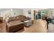 Comfortable living room showcasing a leather sectional sofa and wood flooring at 1758 S Tucson St, Aurora, CO 80012