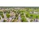 A suburban neighborhood with mature trees, green space, and a community park with a pond at 1758 S Tucson St, Aurora, CO 80012