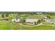 Scenic park view with a pond, walking paths, picnic area, and lush green space at 1758 S Tucson St, Aurora, CO 80012