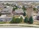 Aerial view of home featuring mature landscaping, driveway, and surrounding neighborhood at 5810 Moss Ct, Golden, CO 80403