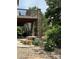 Stone bench seating near backyard landscape at 5810 Moss Ct, Golden, CO 80403