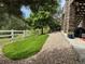 Backyard with manicured lawn and stone pathway at 5810 Moss Ct, Golden, CO 80403