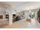 Finished basement with tile floors, fireplace, walkout access, and ample room for entertaining at 5810 Moss Ct, Golden, CO 80403