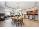 Open basement area features a dining area, living room, and bar with barstool seating at 5810 Moss Ct, Golden, CO 80403