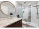 Updated bathroom with stylish glass enclosed shower and marble vanity at 5810 Moss Ct, Golden, CO 80403