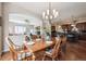 Dining room with hardwood floors, chandelier, and easy access to the kitchen and living area at 5810 Moss Ct, Golden, CO 80403