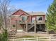 Two-story home with stone accents, upper and lower decks for outdoor enjoyment at 5810 Moss Ct, Golden, CO 80403