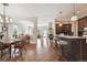 Open-concept living area with hardwood floors, recessed lighting, and seamless transition to the kitchen at 5810 Moss Ct, Golden, CO 80403