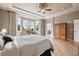 Large main bedroom boasts tray ceilings, exterior views, and an ensuite bathroom at 5810 Moss Ct, Golden, CO 80403
