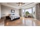 Expansive main bedroom features tray ceilings, large windows, and hardwood floors at 5810 Moss Ct, Golden, CO 80403