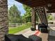 Covered patio with stone pillar detail provides relaxing outdoor space at 5810 Moss Ct, Golden, CO 80403