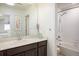 Bathroom featuring a single vanity, tub-shower combo, and modern fixtures with natural light at 9283 Sedalia St, Commerce City, CO 80022