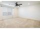 Bedroom featuring neutral carpet, ceiling fan, and plenty of natural light from the window at 9283 Sedalia St, Commerce City, CO 80022