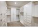 Spacious walk-in closet featuring custom shelving and ample storage space at 9283 Sedalia St, Commerce City, CO 80022