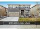 Charming two-story home with a two-car garage and a well-maintained front yard at 9283 Sedalia St, Commerce City, CO 80022