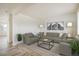 Bright living room featuring neutral tones, stylish decor, and comfortable seating arrangements at 9283 Sedalia St, Commerce City, CO 80022