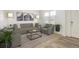 Bright living room featuring neutral tones, stylish decor, and comfortable seating arrangements at 9283 Sedalia St, Commerce City, CO 80022