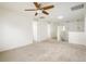 Spacious loft area with carpet flooring, a ceiling fan, and an open layout leading to other rooms at 9283 Sedalia St, Commerce City, CO 80022
