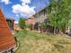 Lush backyard featuring a charming teepee structure, hot tub with gazebo, and well-maintained lawn and landscaping at 10273 Salida St, Commerce City, CO 80022