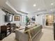 Finished basement with a cozy seating area, stylish decor, and ample lighting at 10273 Salida St, Commerce City, CO 80022