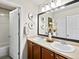 Bright bathroom with double sinks, a large mirror, and decorative accents at 10273 Salida St, Commerce City, CO 80022