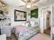 Cozy bedroom features a comfortable bed, a decorative mirror, and stylish decor at 10273 Salida St, Commerce City, CO 80022