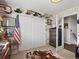 Unique bedroom with wood paneling, American Flag, sliding closet doors and a cowhide rug at 10273 Salida St, Commerce City, CO 80022