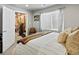 Bright bedroom features a comfortable bed, a window with sheer curtains, and exercise equipment at 10273 Salida St, Commerce City, CO 80022