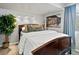 Serene bedroom with a comfortable bed, modern lighting, and a nature-inspired artwork at 10273 Salida St, Commerce City, CO 80022
