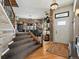 Inviting foyer with hardwood floors, staircase with wood and iron railings, and stylish chandelier at 10273 Salida St, Commerce City, CO 80022